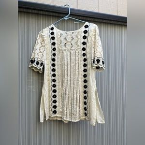 Bohemian ivory top accented with embroidery and sequins